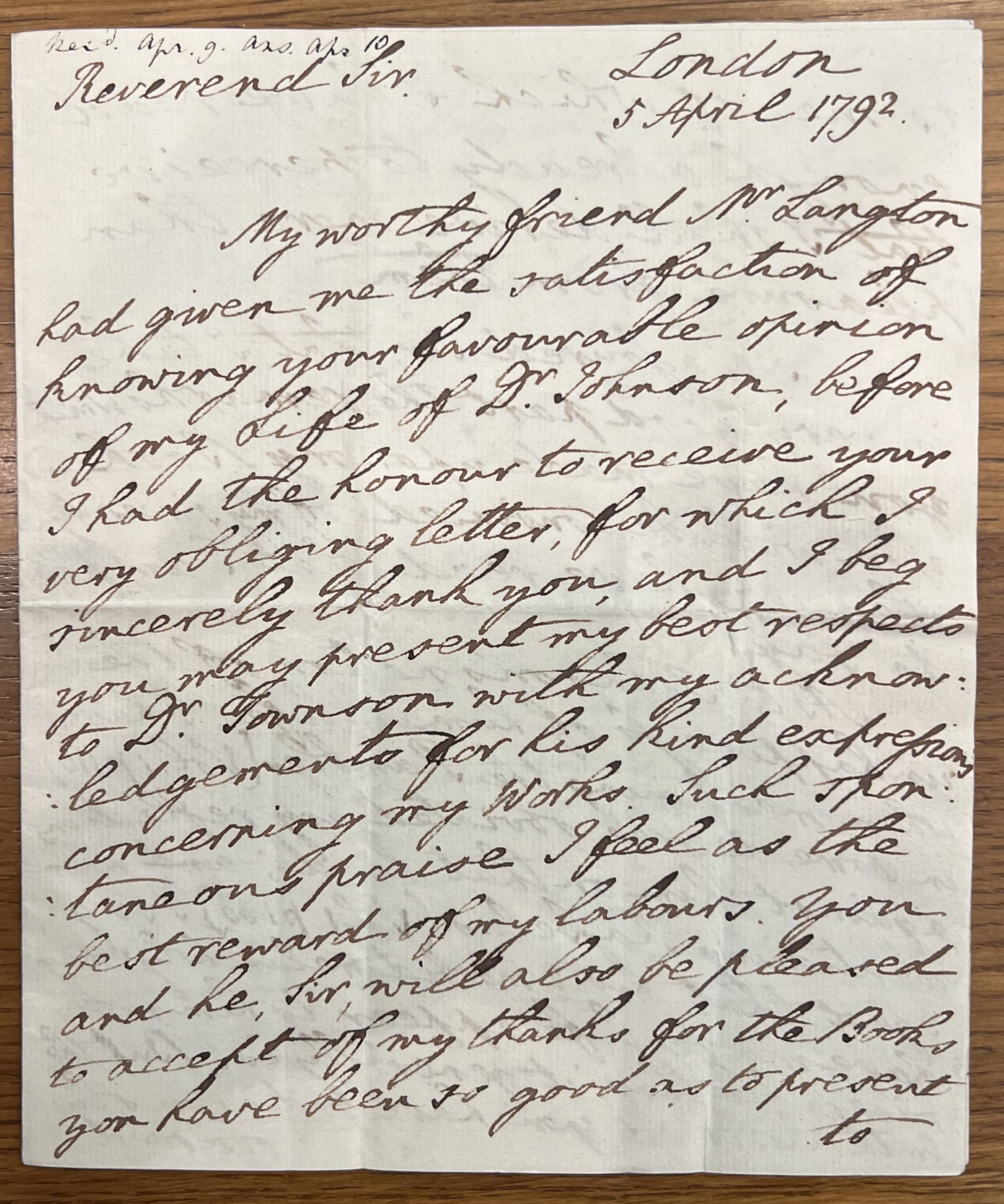 A handwritten letter with brown ink and cursive script